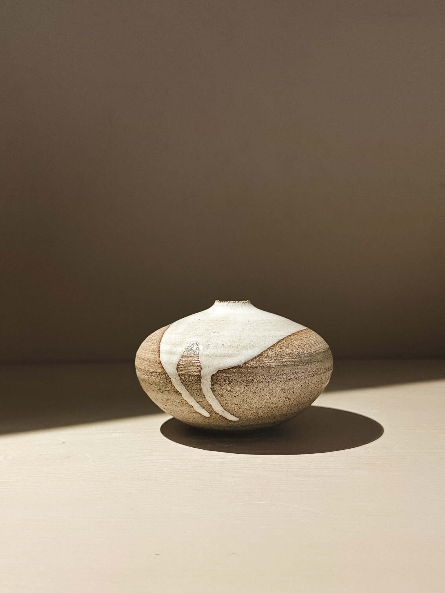 Orb Vase – Yuki Ash #05 with unique glaze patterns and rounded sculptural form.