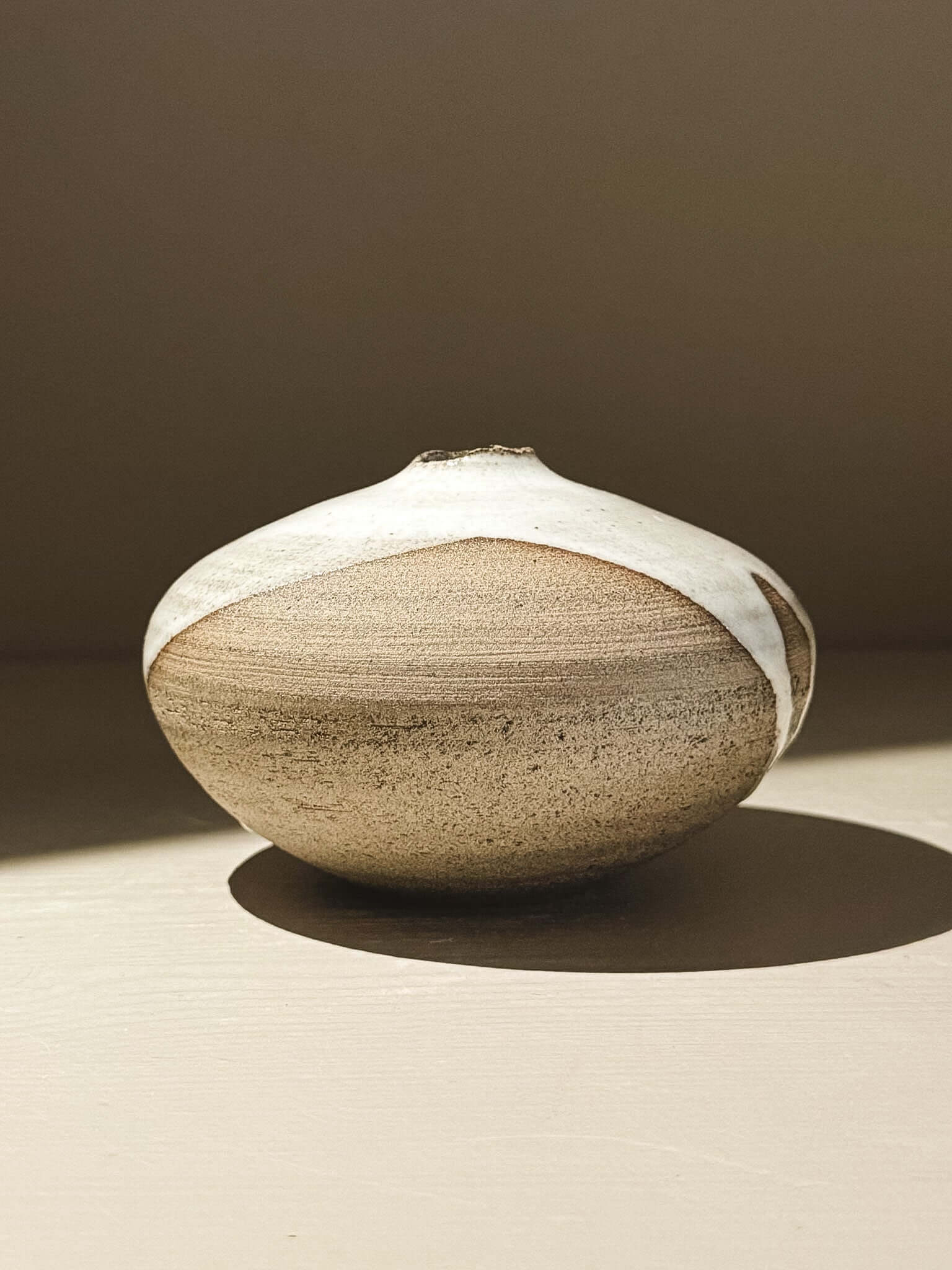 Orb Vase – Yuki Ash #05 with soft spherical form and unique organic glaze patterns.