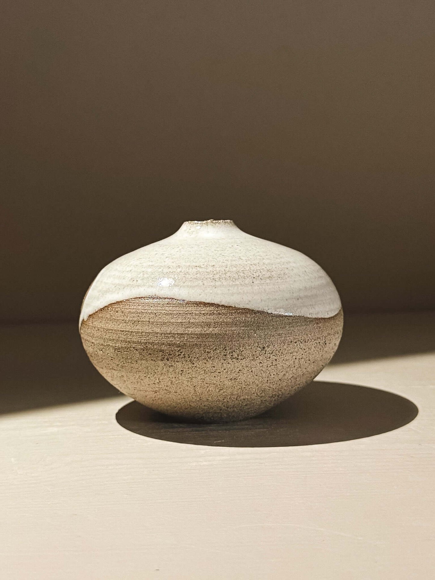 Orb Vase – Yuki Ash #06 with gentle drips and organic patterns, showcasing its calm, sculptural form.