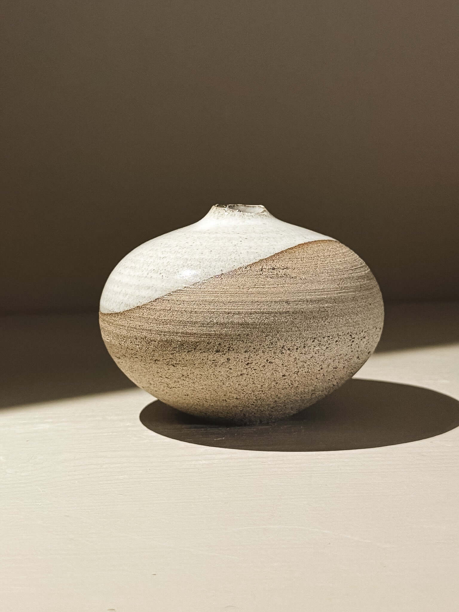 Orb Vase – Yuki Ash #06 with soft spherical form and unique glaze patterns.