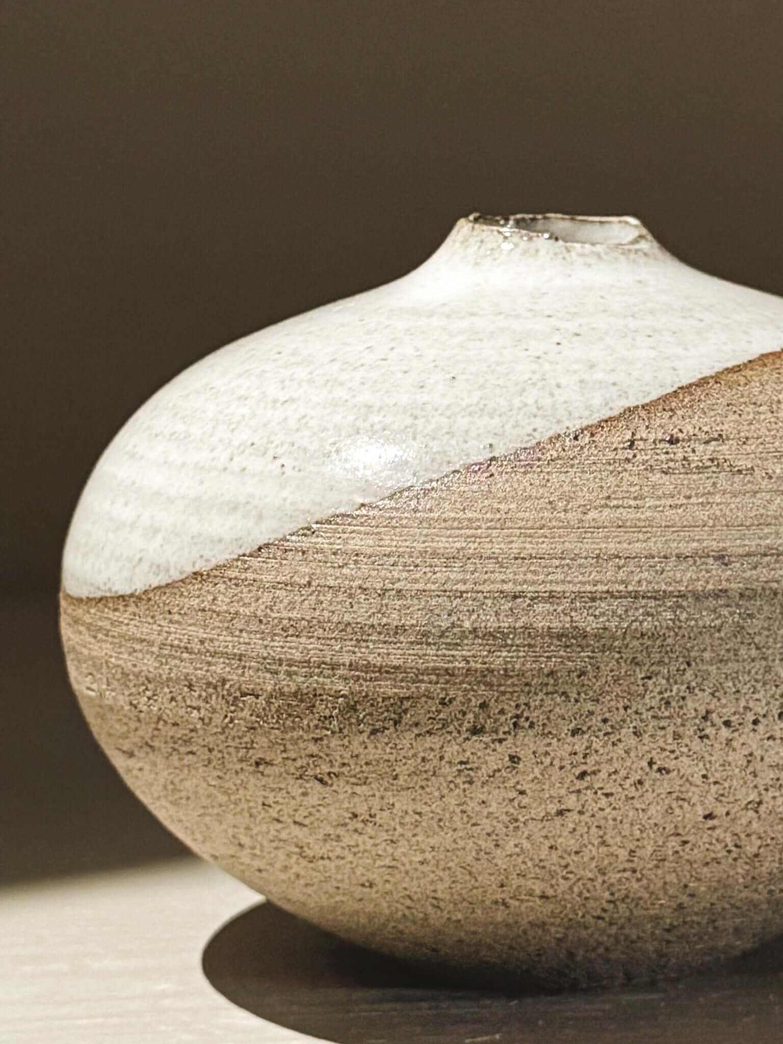 Orb Vase – Yuki Ash #06 showcasing unique glaze patterns and rounded form, a serene decorative piece.