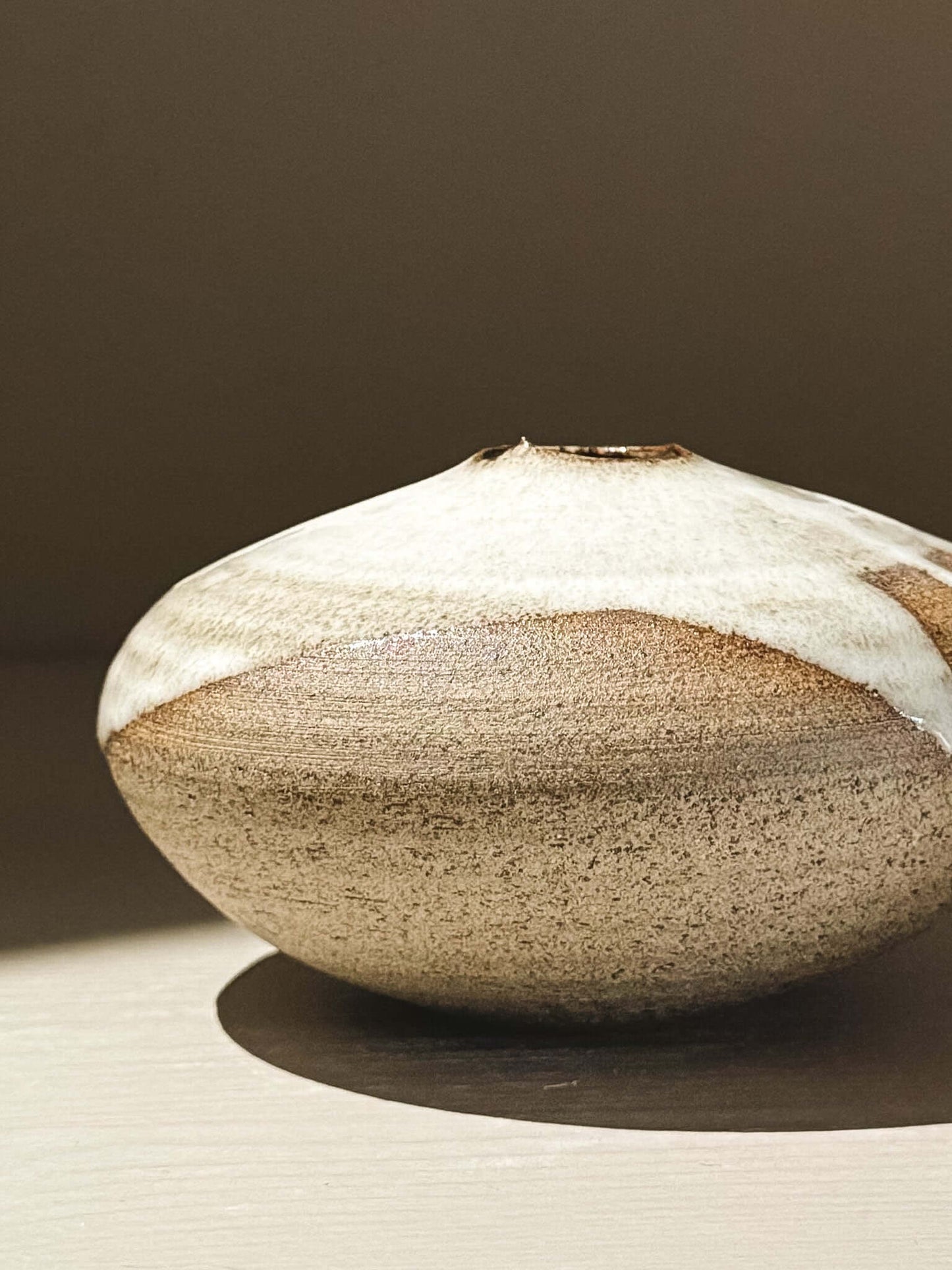 Orb Vase – Yuki Ash #07, a Japanese handmade ceramic orb vase with a unique glaze design.