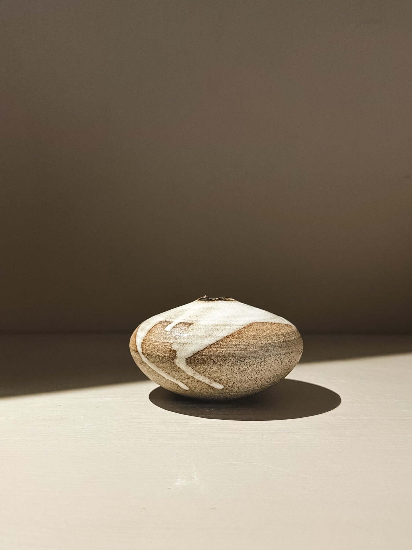 Orb Vase – Yuki Ash #07, a Japanese handmade ceramic orb vase with unique glaze patterns.