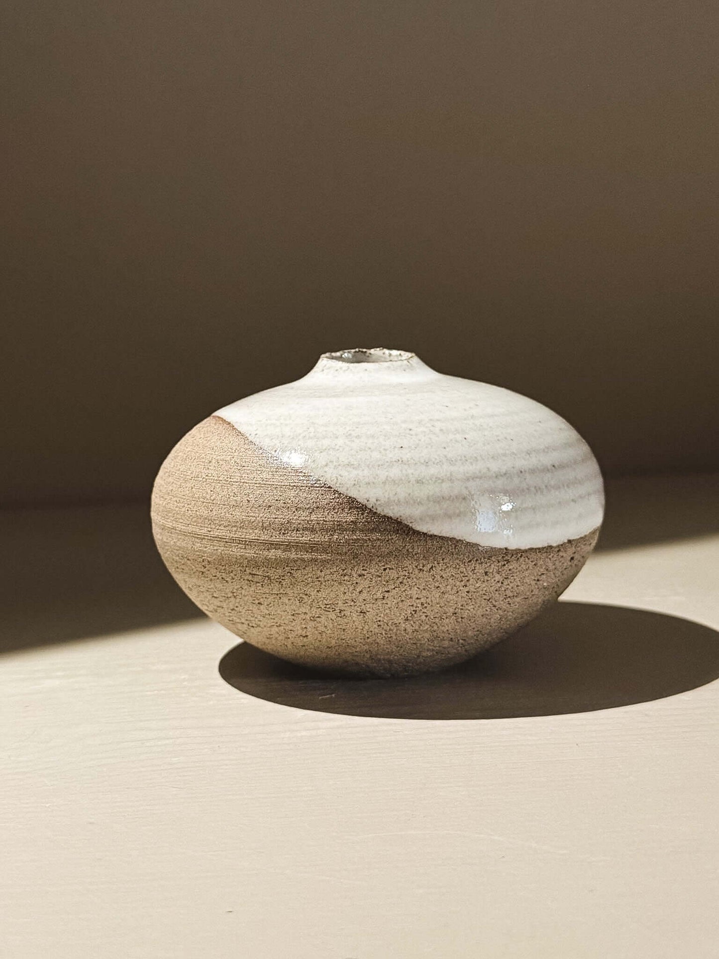 Orb Vase – Yuki Ash #08, a Japanese handmade ceramic orb vase with unique glaze patterns.