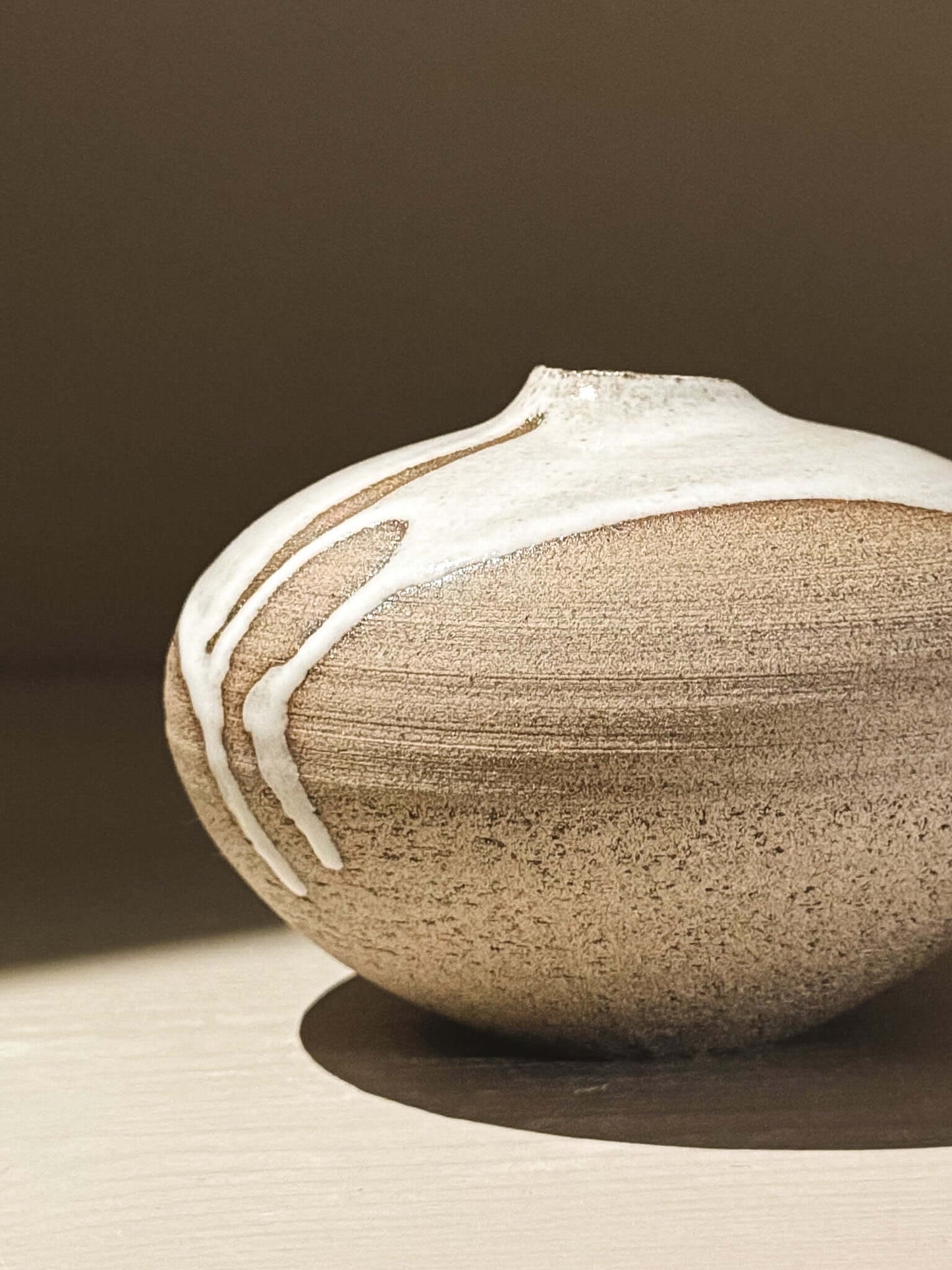 Orb Vase – Yuki Ash #08, a Japanese handmade ceramic orb vase with unique glaze patterns and soft spherical form.
