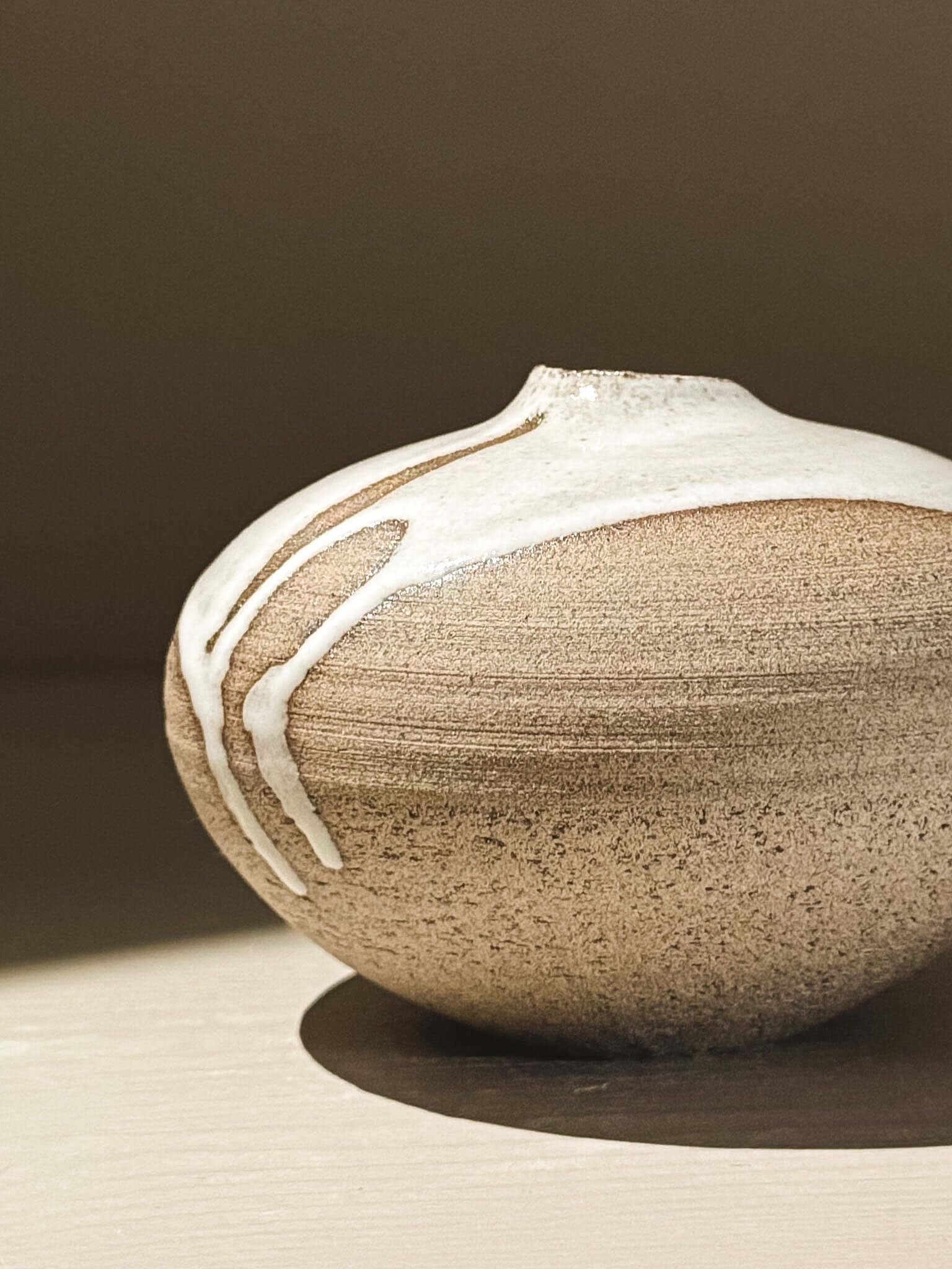 Orb Vase – Yuki Ash #08, a Japanese handmade ceramic orb vase with unique glaze patterns and soft spherical form.