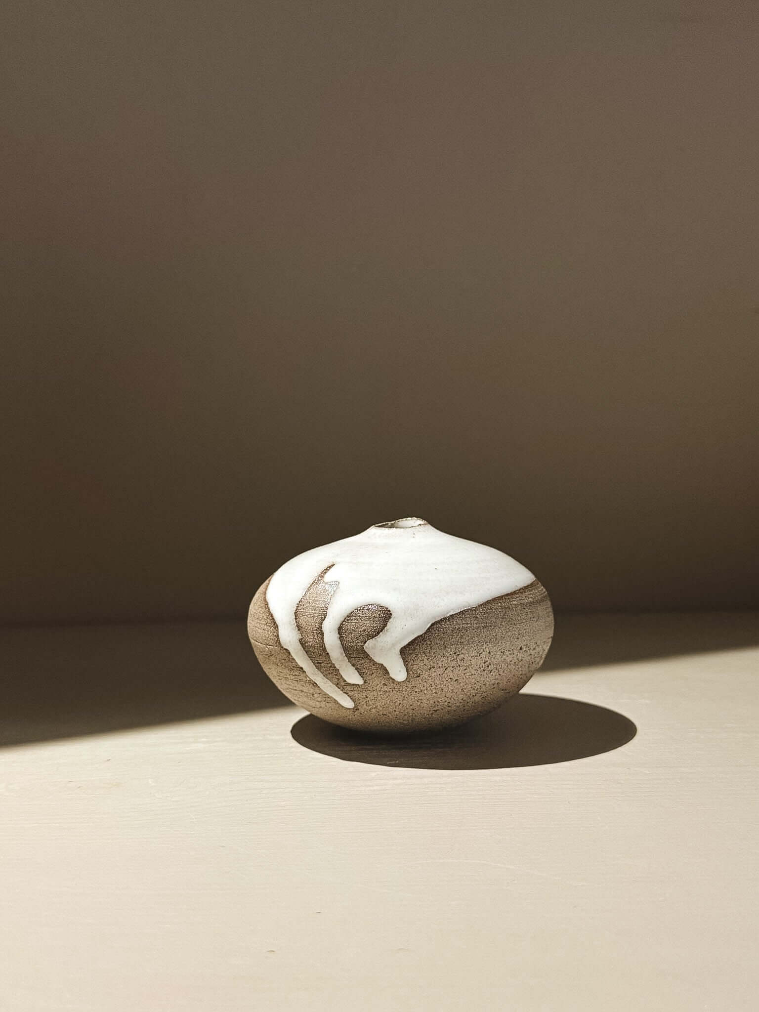 Orb Vase – Yuki Ash #09, a unique Japanese handmade ceramic orb vase with organic glaze patterns.