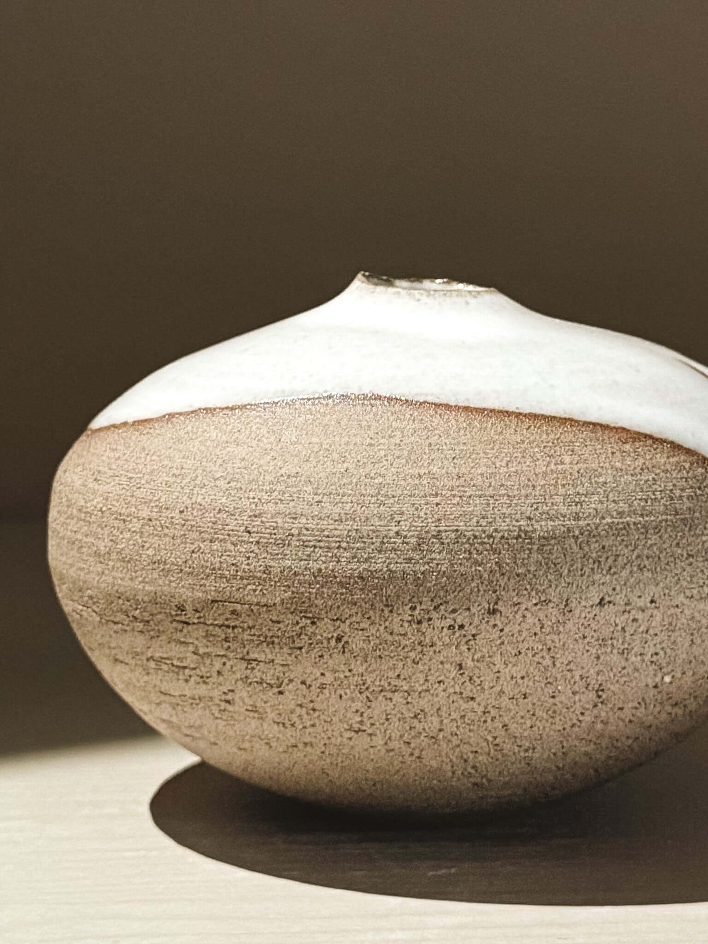 Orb Vase – Yuki Ash #09 - Japanese handmade ceramic orb vase with a soft spherical form and organic glaze patterns.