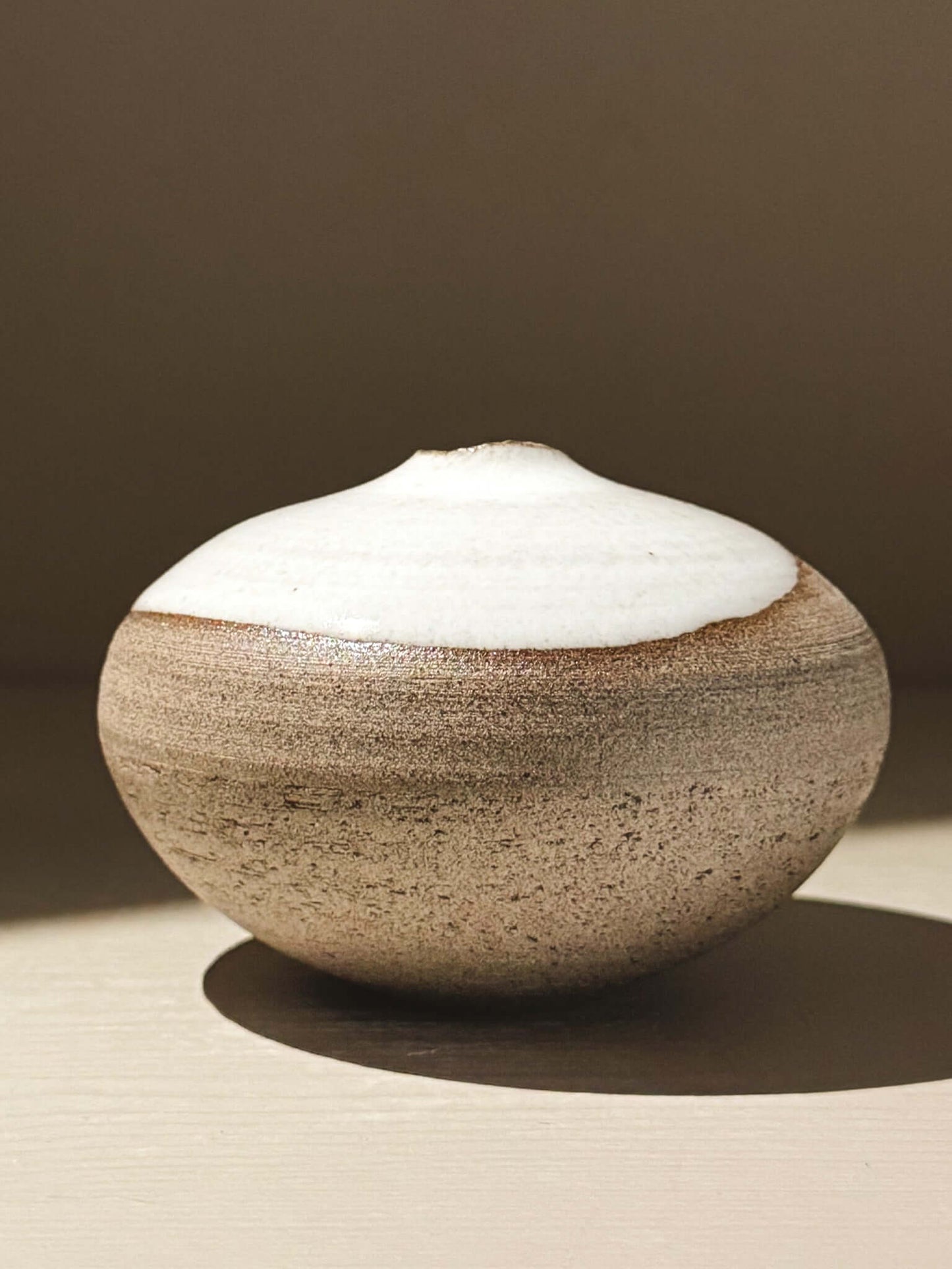 Orb Vase – Yuki Ash #09 - Japanese handmade ceramic orb vase with unique glaze patterns and rounded form.