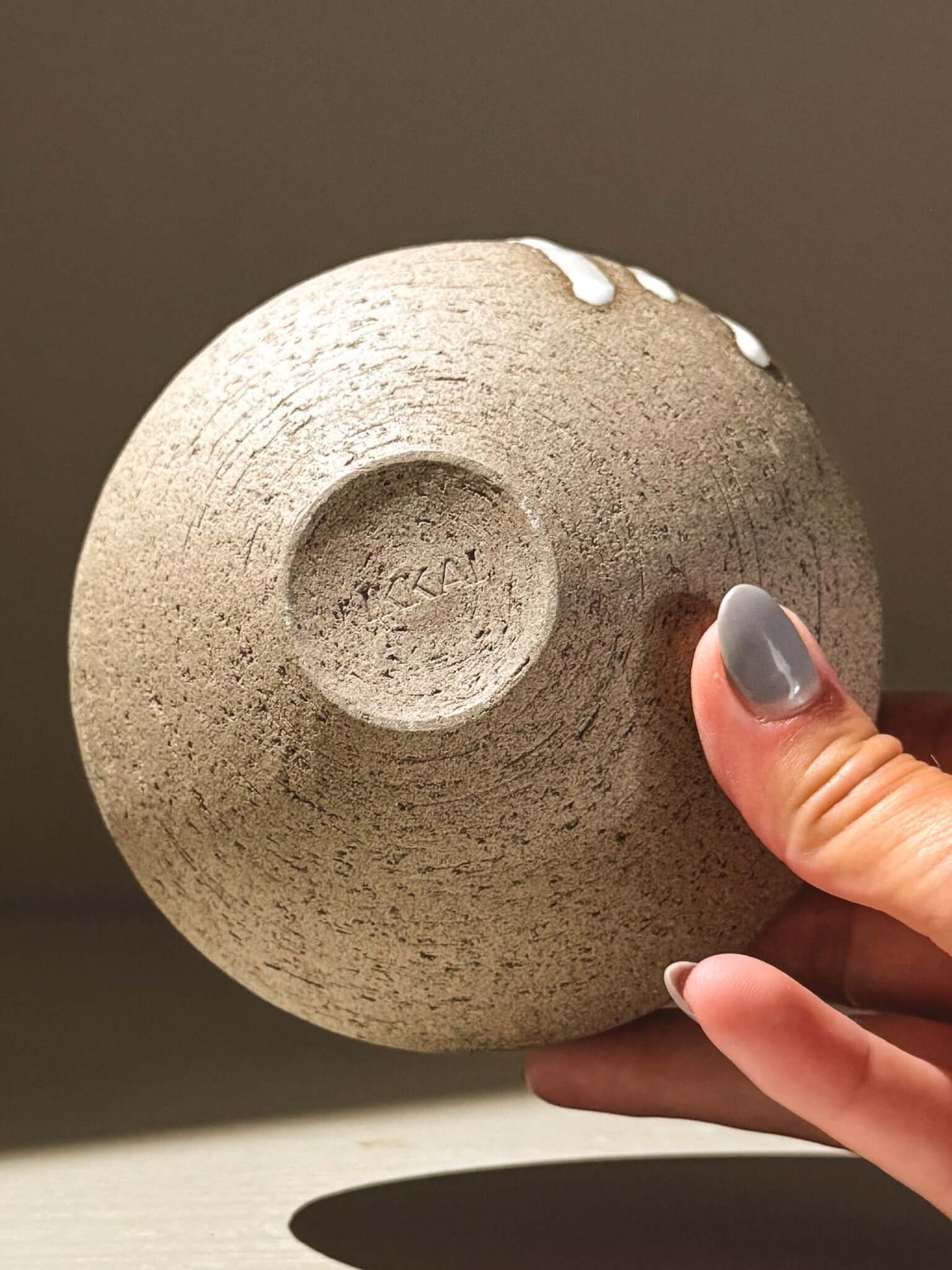 Orb Vase – Yuki Ash #09, a unique Japanese handmade ceramic orb vase showcasing natural glaze patterns.