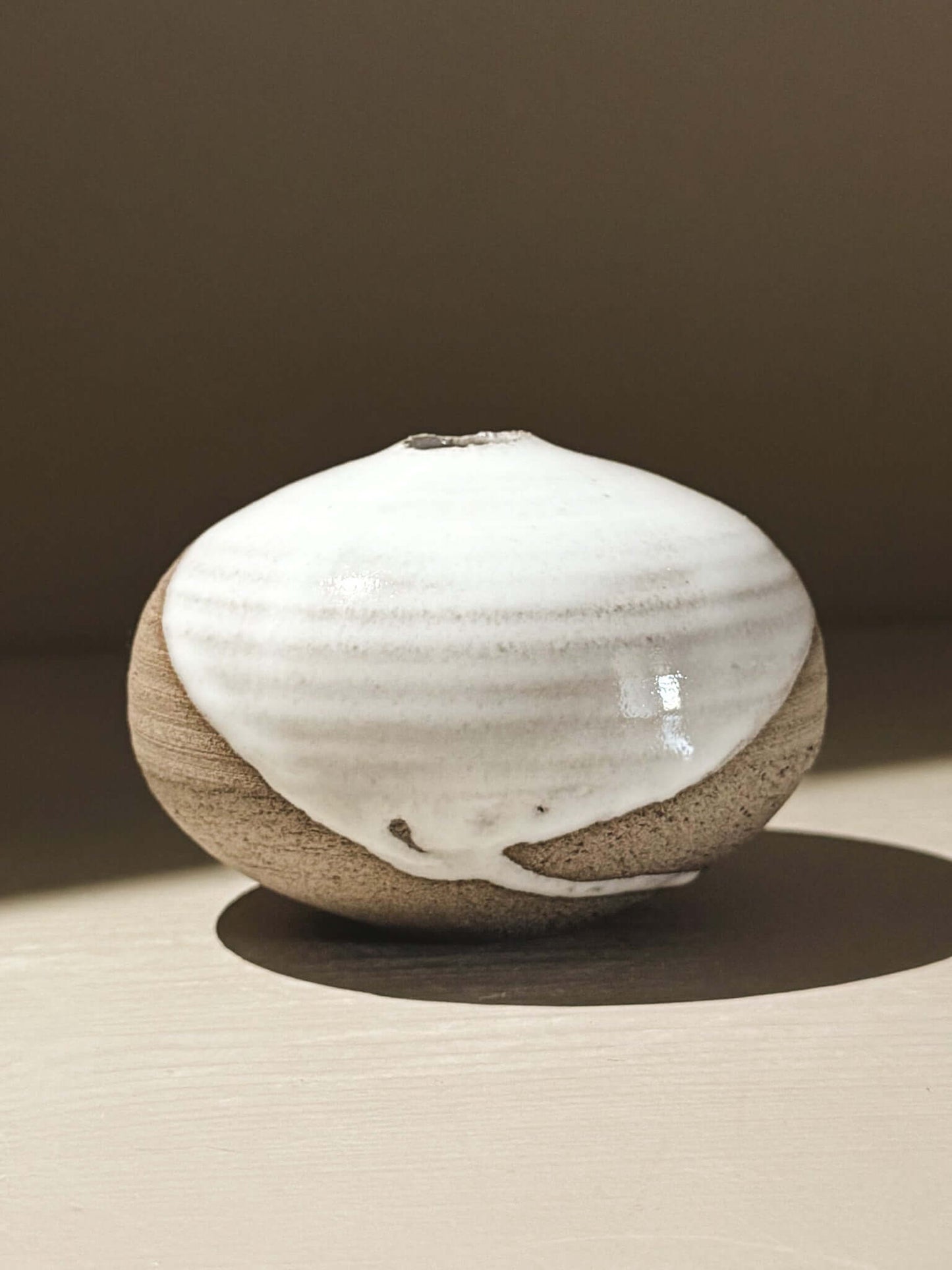 Orb Vase – Yuki Ash #11, a unique japanese handmade ceramic orb vase with natural glaze patterns.