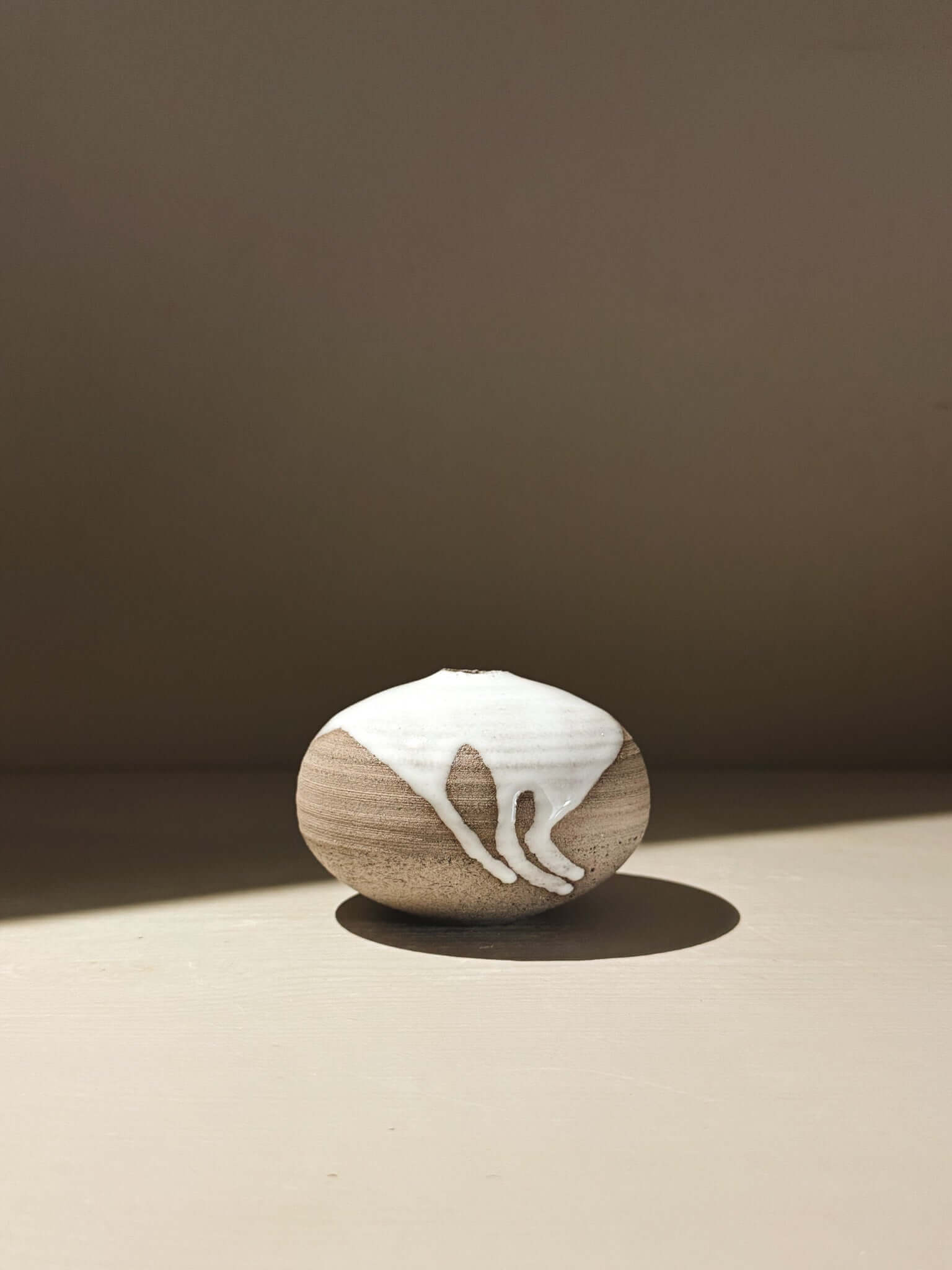 Orb Vase – Yuki Ash #11, a japanese handmade ceramic orb vase with unique glaze patterns.