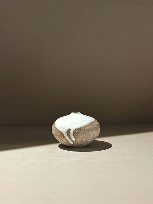 Orb Vase – Yuki Ash #12, a unique handmade ceramic orb vase with organic glaze patterns.