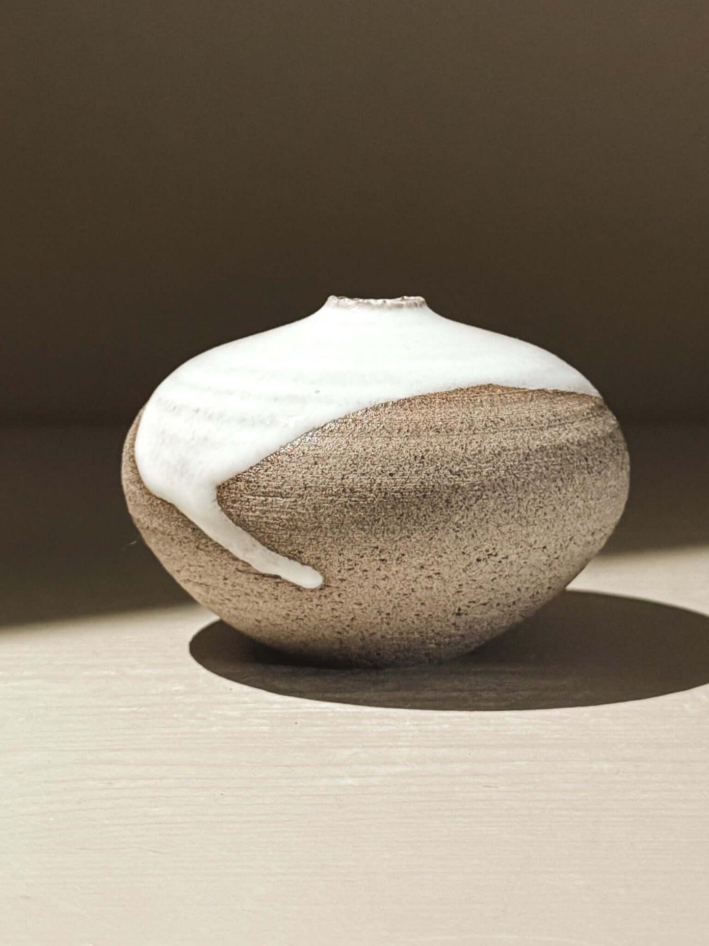 Orb Vase – Yuki Ash #12, a unique Japanese handmade ceramic orb vase with natural glaze patterns.