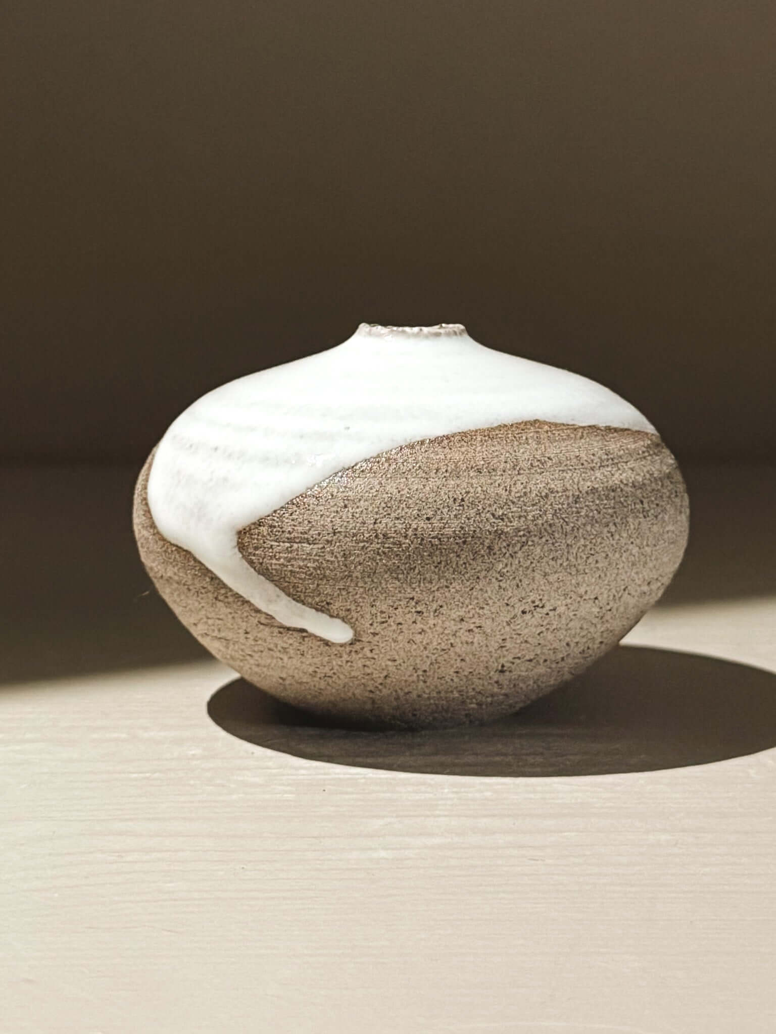 Orb Vase – Yuki Ash #12, a unique Japanese handmade ceramic orb vase with natural glaze patterns.