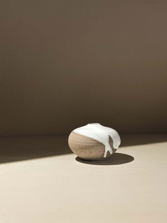 Handmade ceramic Japanese orb vase in Yuki Ash #14 with natural glaze movement and soft, rounded shape.