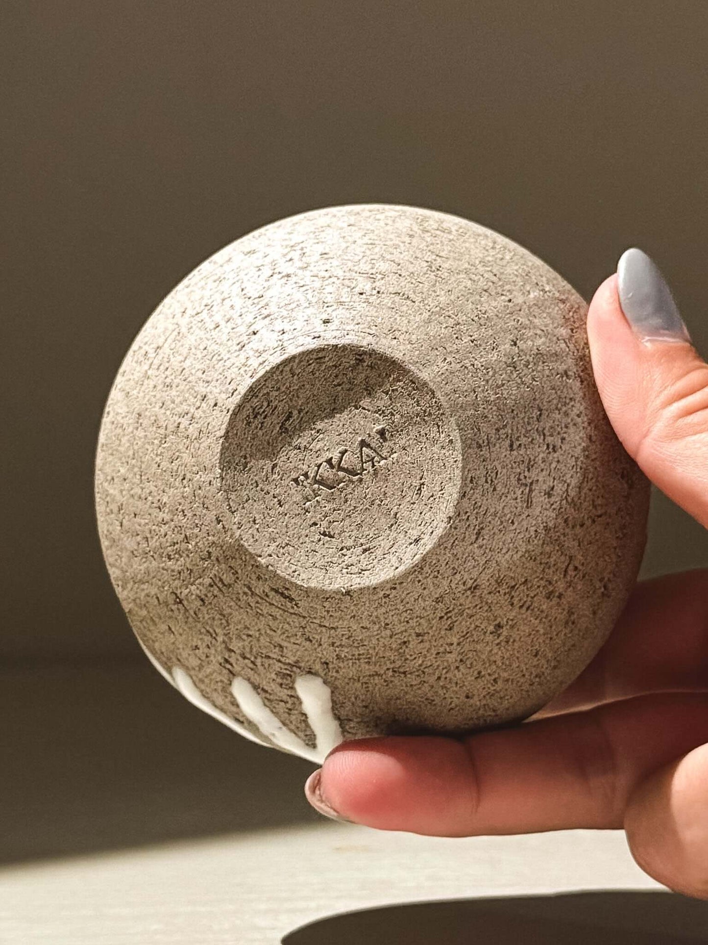 Handmade ceramic Japanese orb vase – Yuki Ash #14, showing unique glaze and organic patterns.