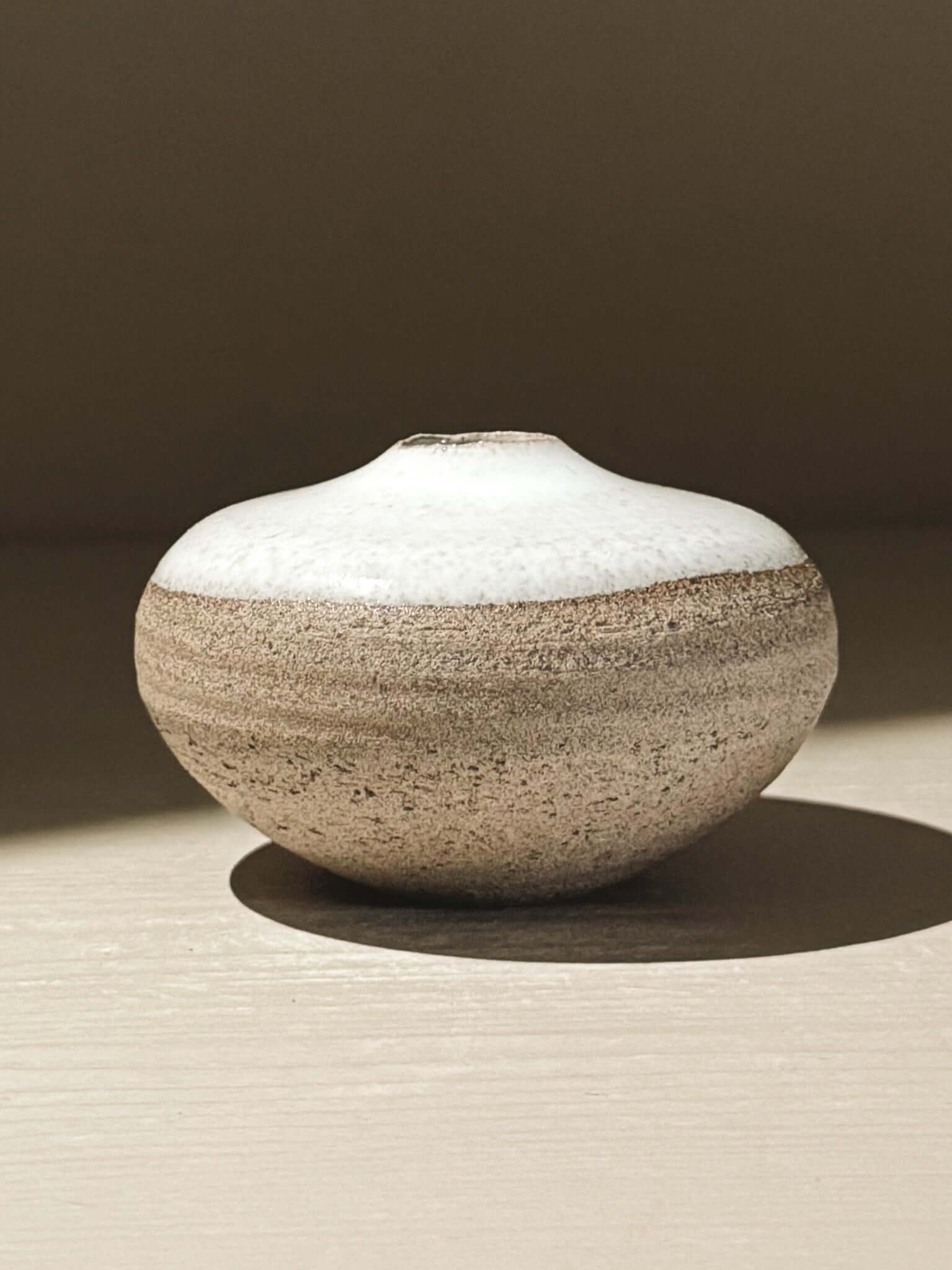 Handmade ceramic Japanese orb vase – Yuki Ash #15 with unique glaze patterns and organic shape.