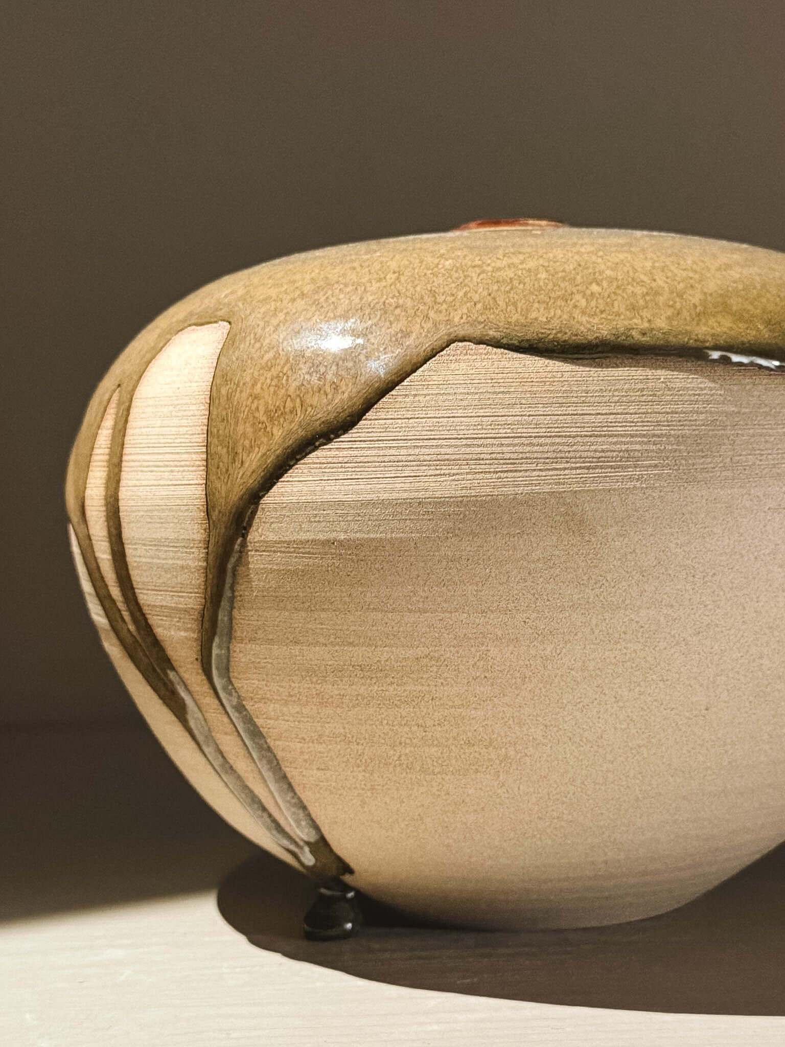 Handmade ceramic Japanese orb vase Orb Vase – Tenmoku #02 showcasing unique glaze patterns.