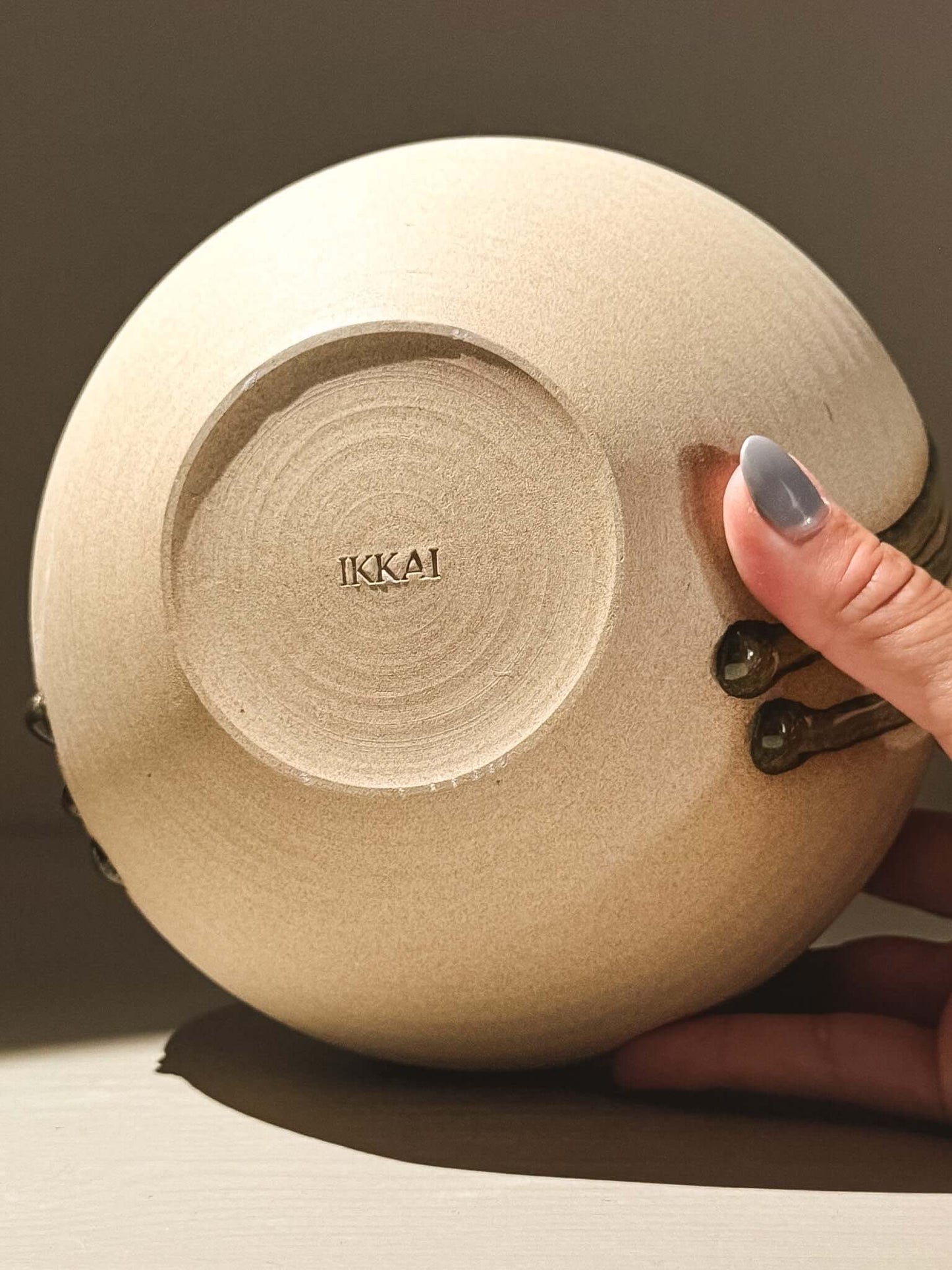 Handmade ceramic Japanese orb vase, Orb Vase – Tenmoku #03, featuring unique glaze patterns and organic shapes.