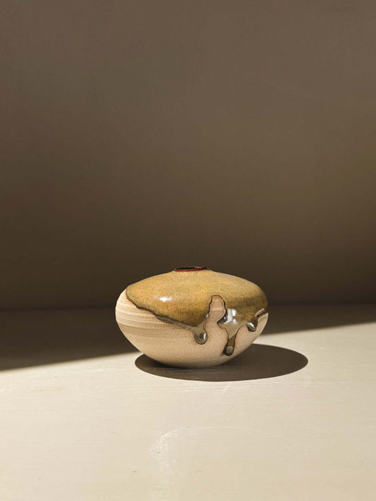 Handmade ceramic Japanese orb vase, Orb Vase – Tenmoku #05, showcasing unique glaze movement.