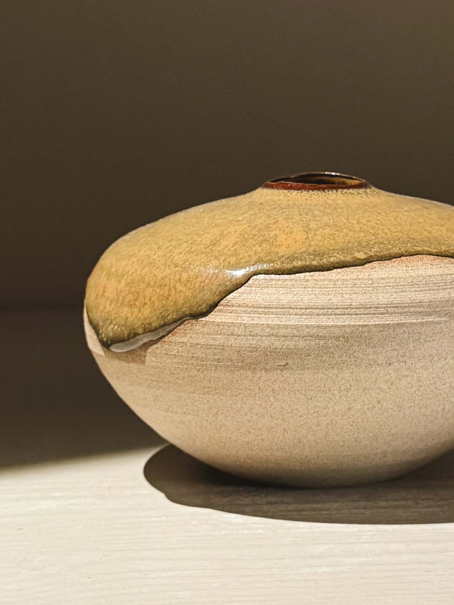 Handmade ceramic Japanese orb vase – Tenmoku #06 with unique glaze movement and organic patterns.
