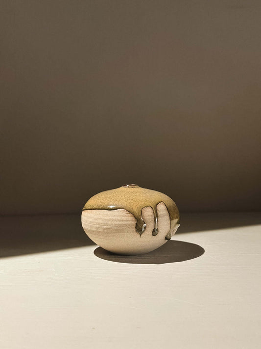 Orb Vase – Tenmoku #07 showcasing a unique glaze pattern on a rounded, sculptural form.