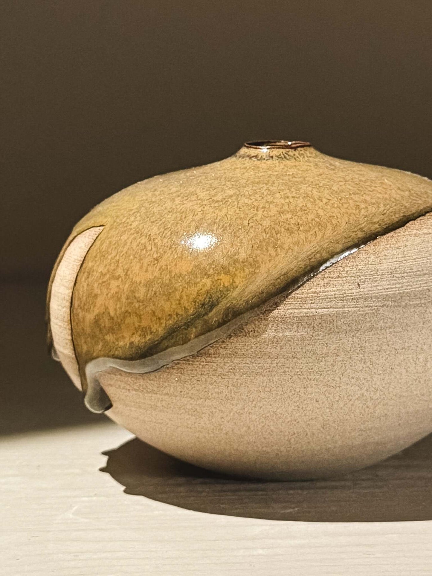 Orb Vase – Tenmoku #07 showcasing natural glaze movement and unique organic patterns, perfect for decorative display.