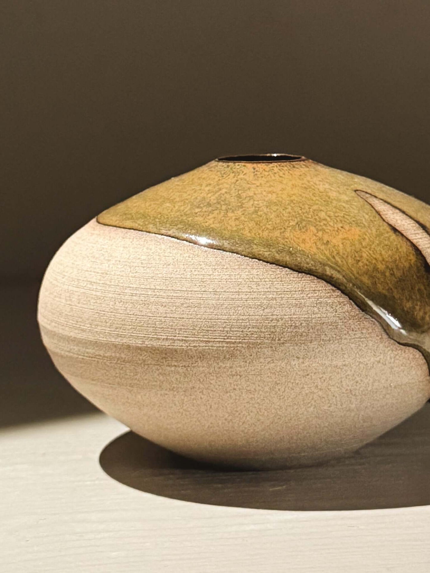Orb Vase – Tenmoku #08 featuring handmade ceramics with unique glaze patterns and a soft spherical form.
