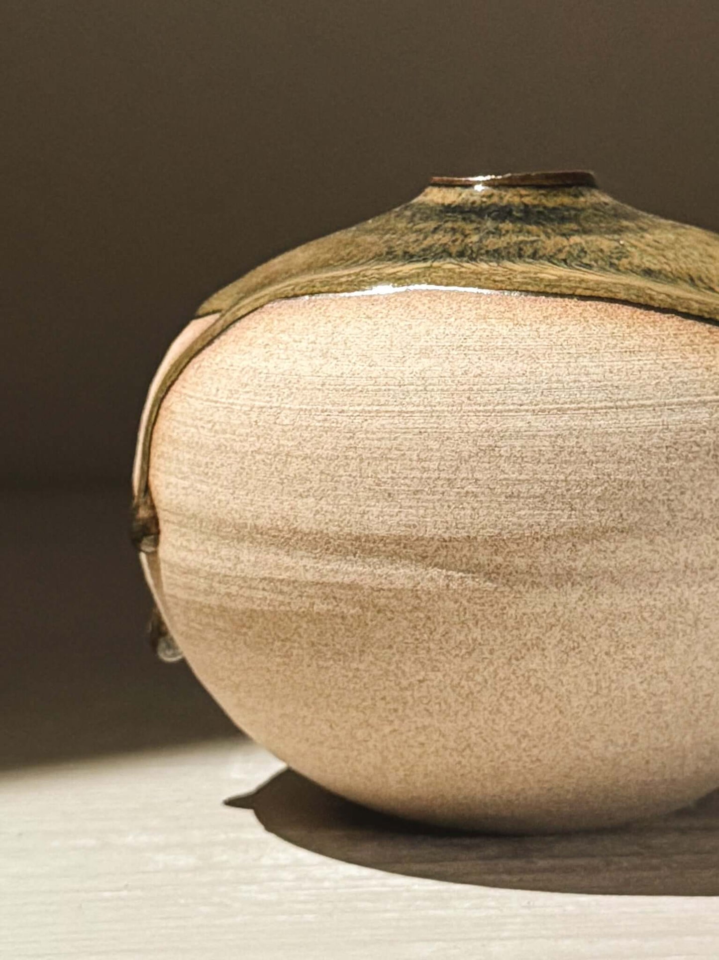 Orb Vase – Tenmoku #09, a handmade ceramics piece with soft, sculptural form and unique glaze drips.