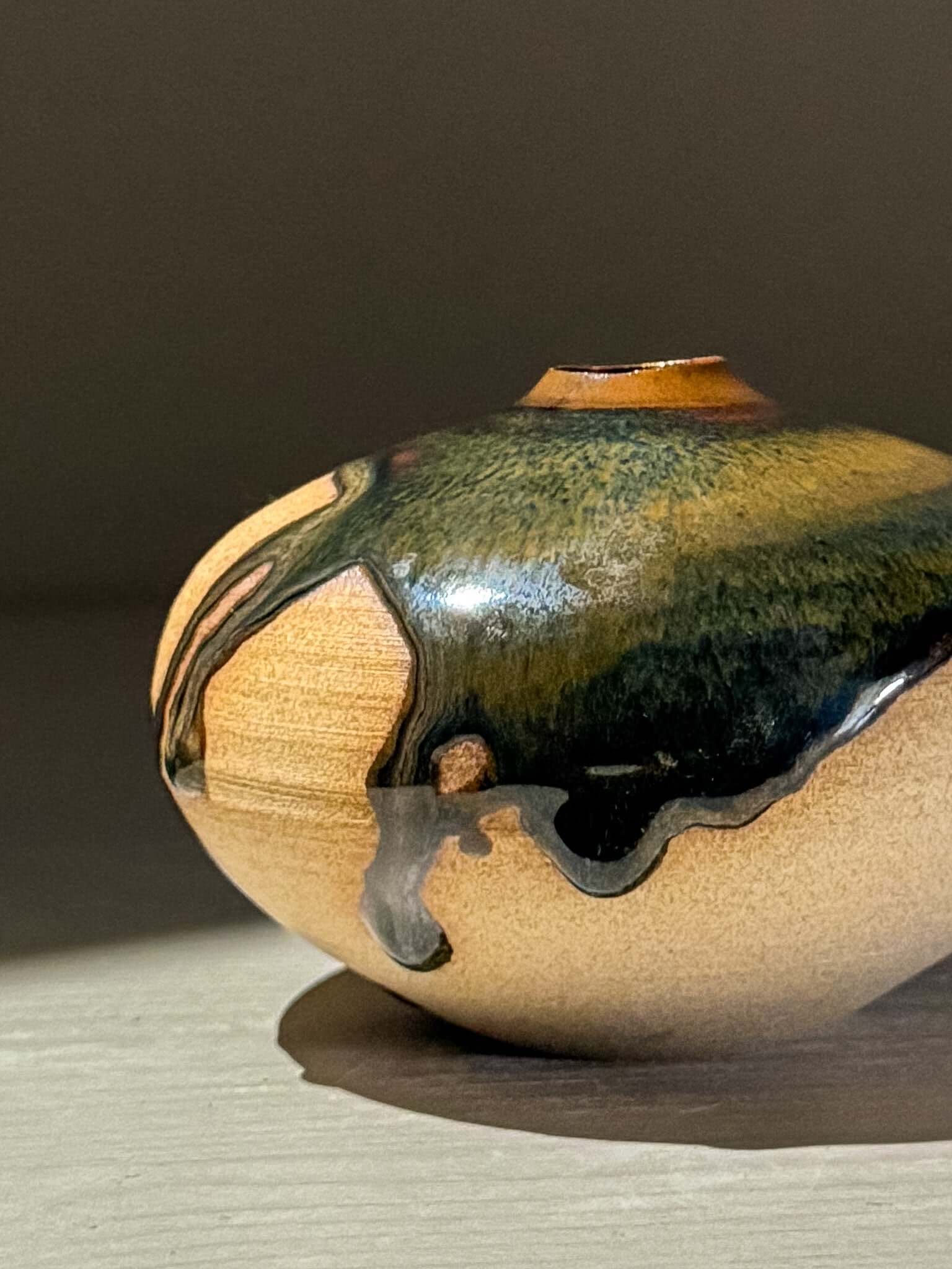 Orb Vase – Tenmoku #10, handmade ceramics with unique glaze patterns and organic shapes.