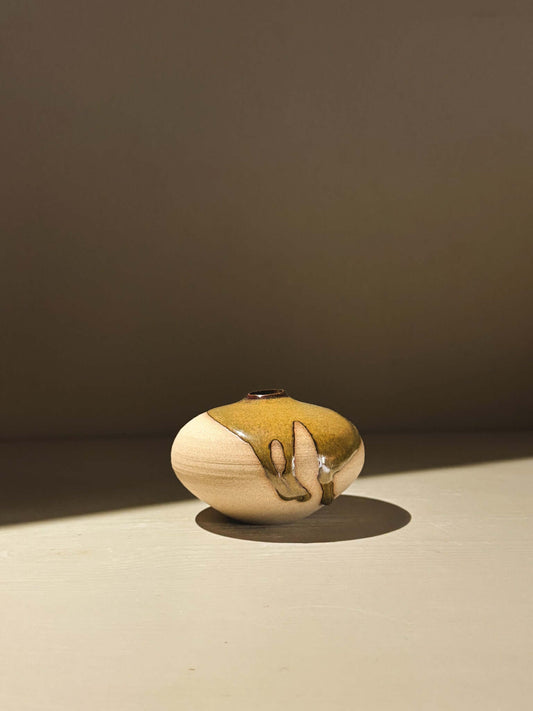 Handmade ceramics Orb Vase – Tenmoku #11 showcasing unique glaze patterns and soft, spherical form.