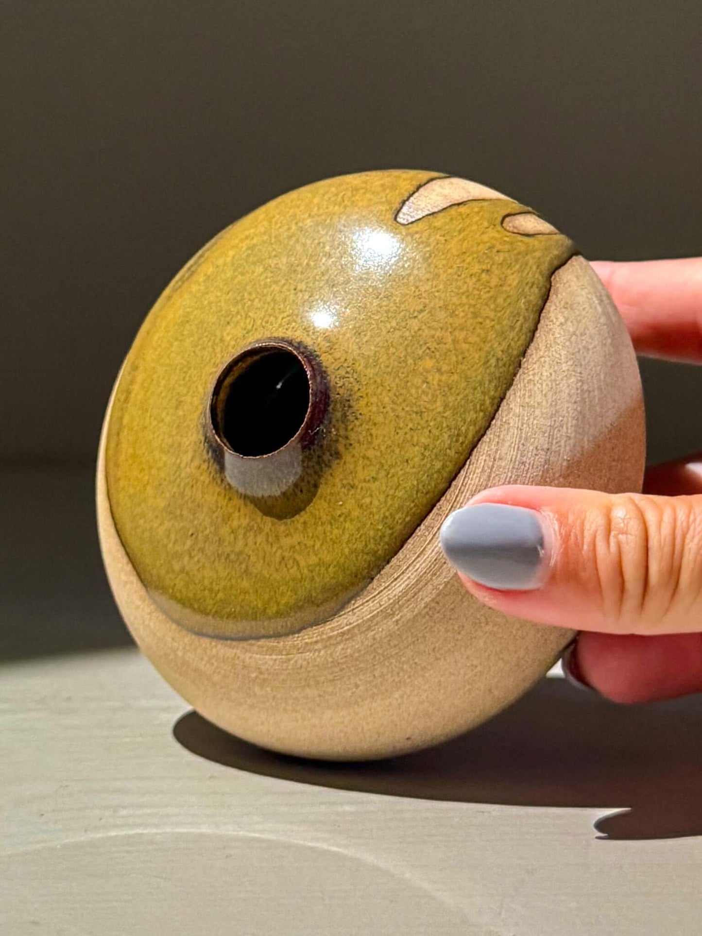 Handmade ceramic Orb Vase – Tenmoku #11 with natural glaze and unique textures, featured in a rounded design.