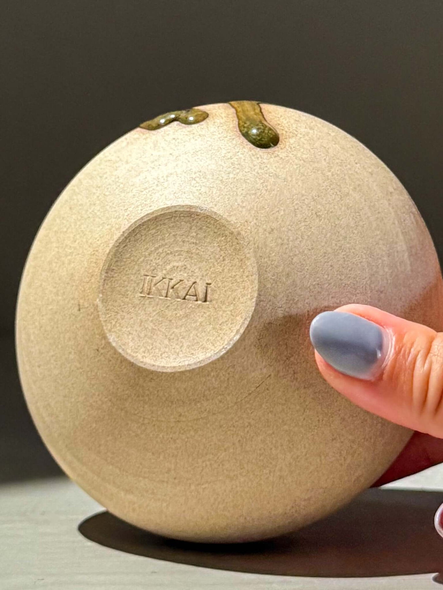 Handmade ceramics Orb Vase – Tenmoku #11 with natural glaze drips, showcasing the unique design and craftsmanship.
