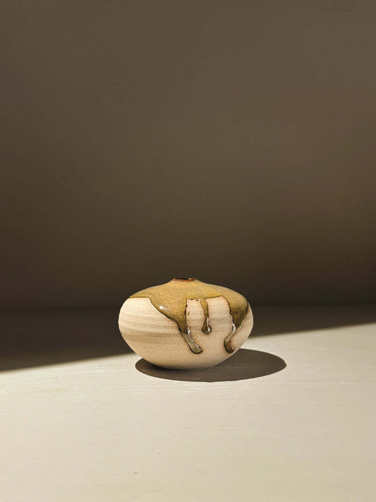 Handmade ceramics featuring the Orb Vase – Tenmoku #12 with unique glaze and organic patterns.