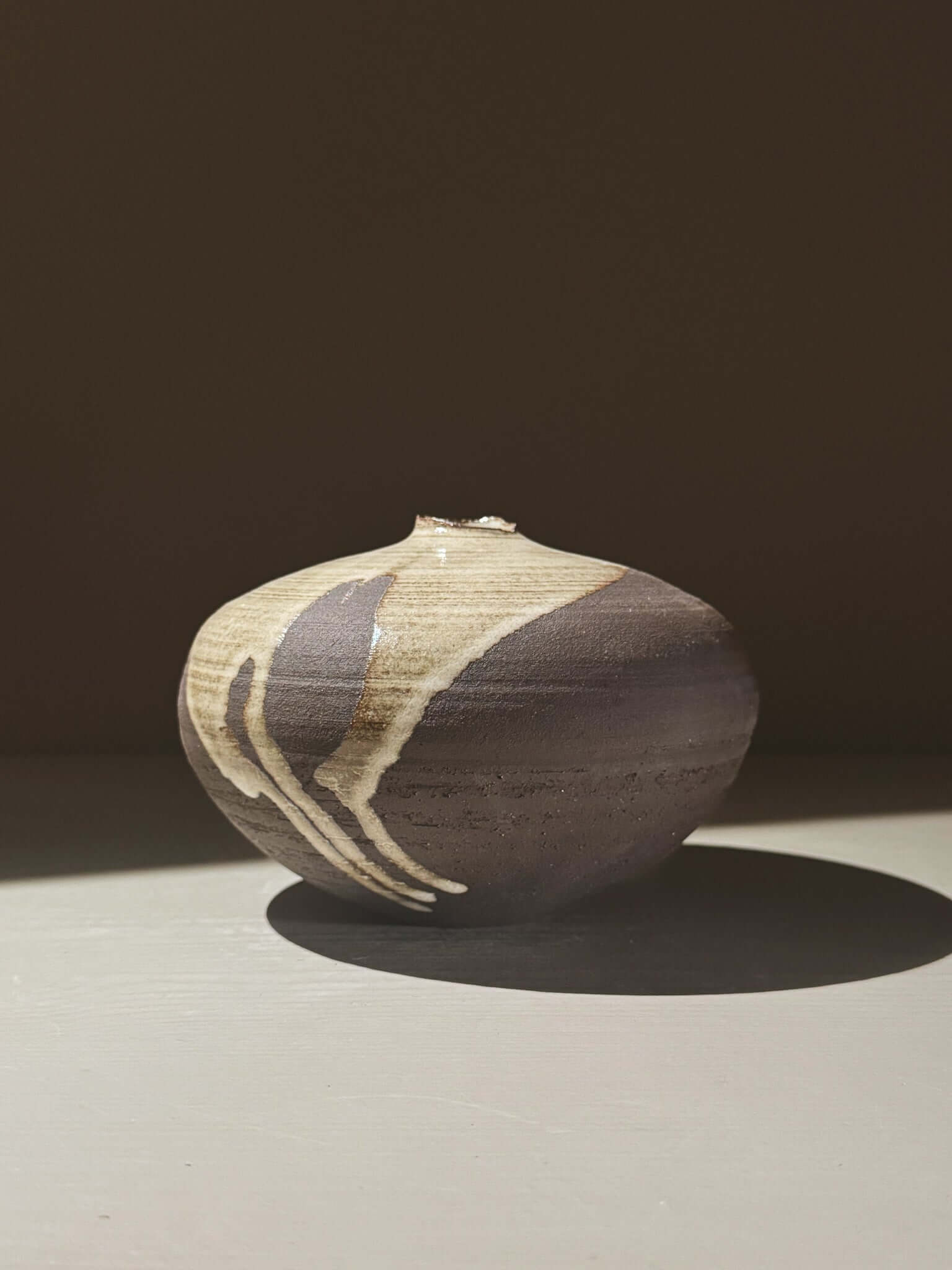 Orb Vase – Yuki Black #01 showcasing natural glaze and unique rounded design, perfect for home decor.
