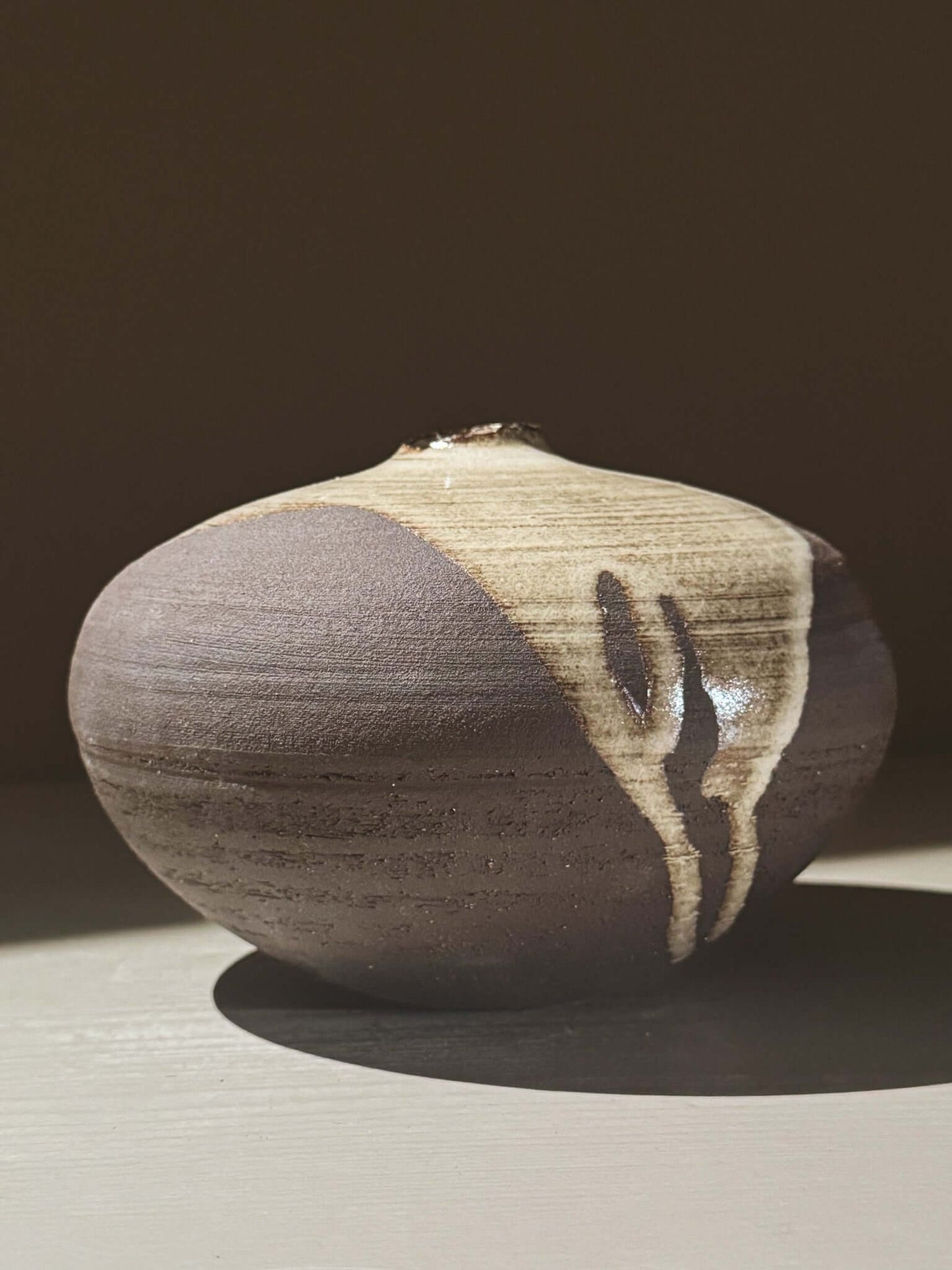 Orb Vase – Yuki Black #01 showcasing its unique glaze movement and sculptural form.