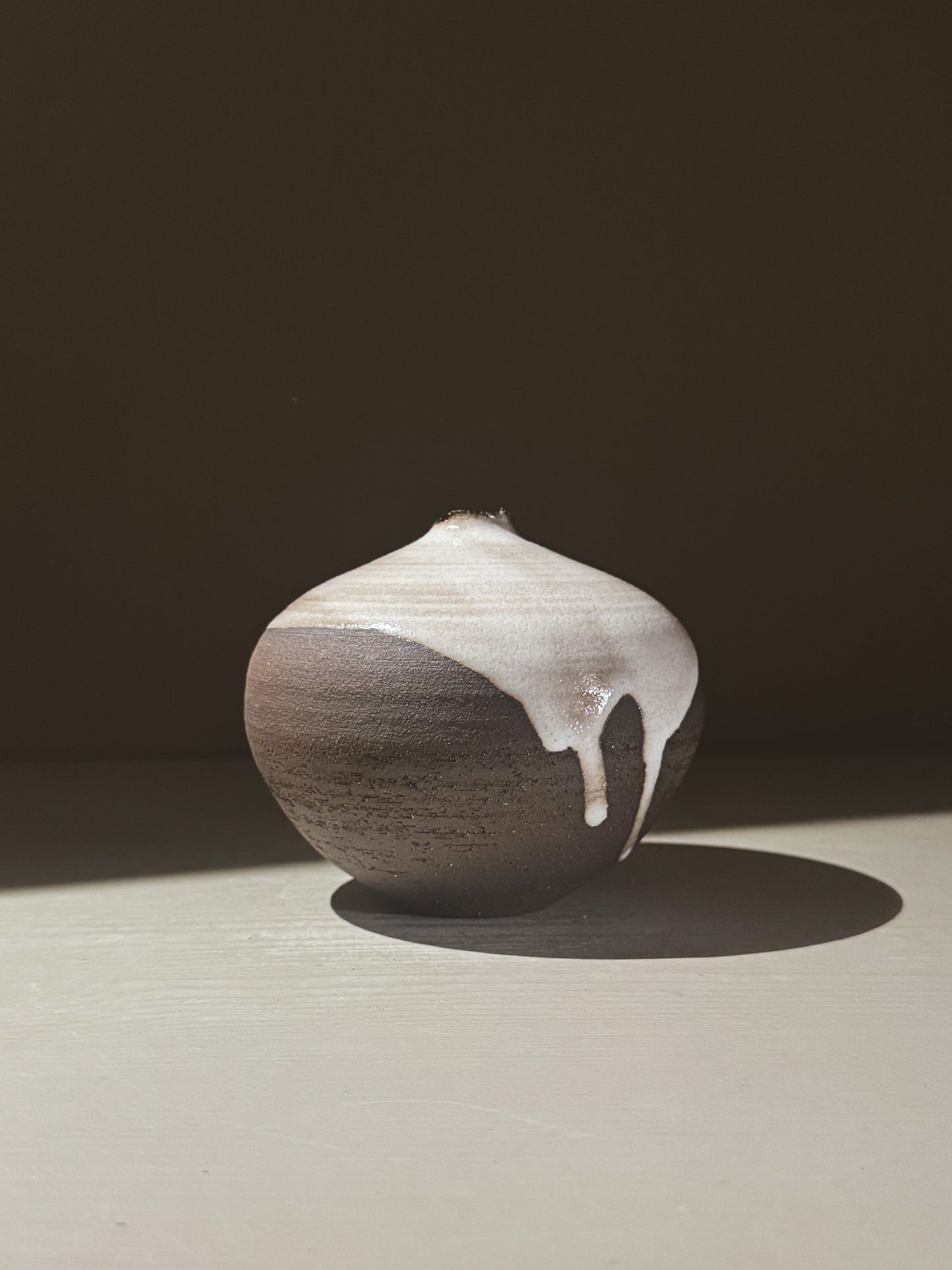 Orb Vase – Yuki Black #02 showcasing a unique glaze with gentle drips and a sculptural presence.