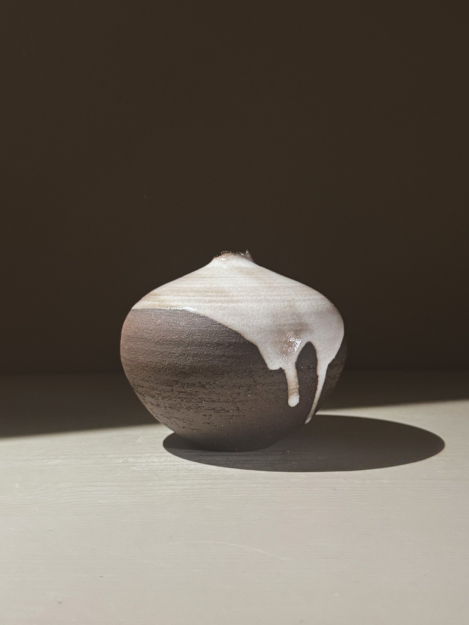 Orb Vase – Yuki Black #02 showcasing a unique glaze with gentle drips and a sculptural presence.