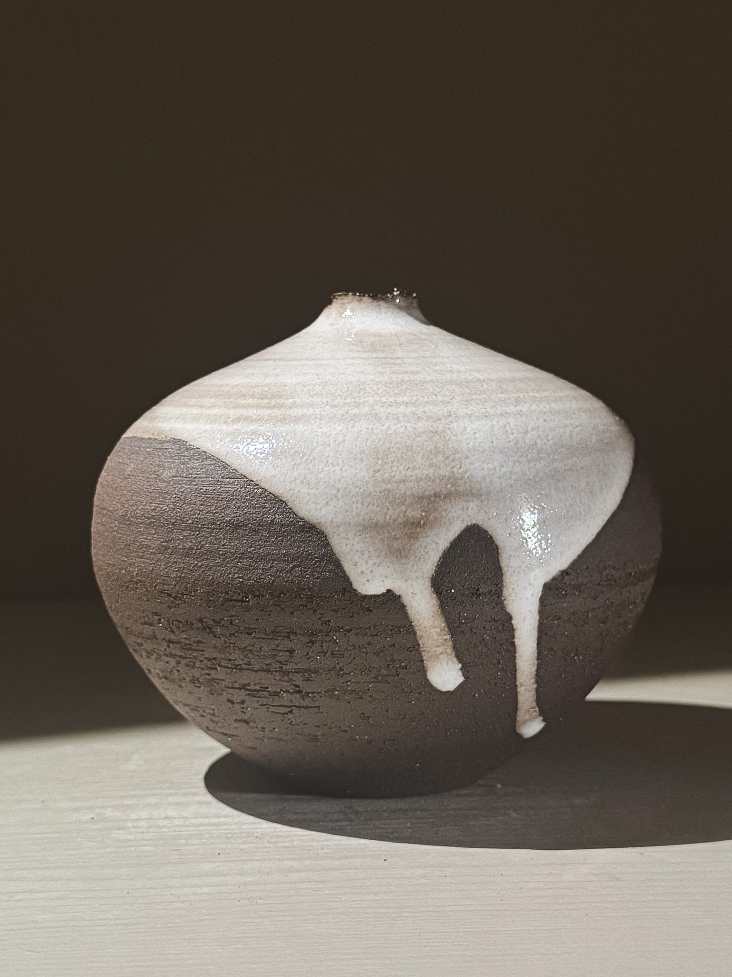 Orb Vase – Yuki Black #02 with unique glaze drips and soft spherical form, adding a calm, sculptural presence.