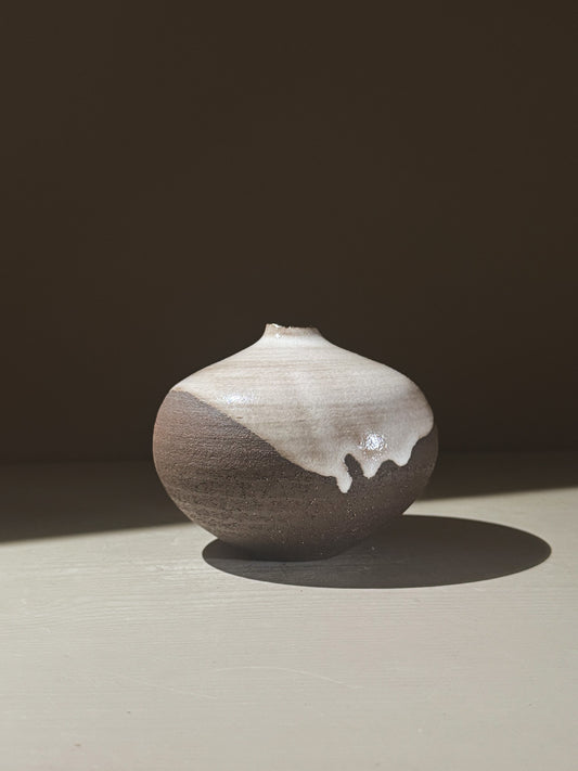 Orb Vase – Yuki Black #03, a unique spherical vase with gentle glaze drips and organic patterns.