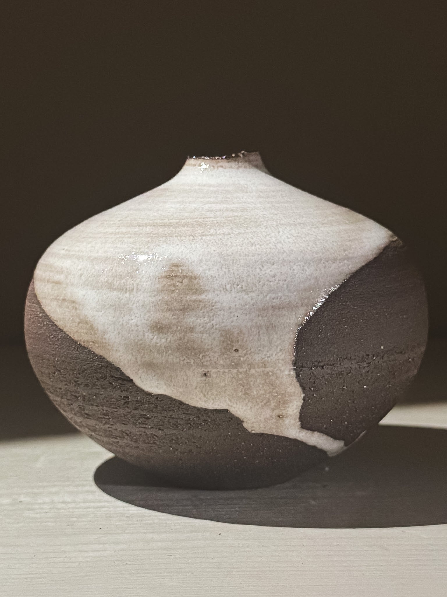 Orb Vase – Yuki Black #03 featuring a unique glaze pattern and soft spherical shape.