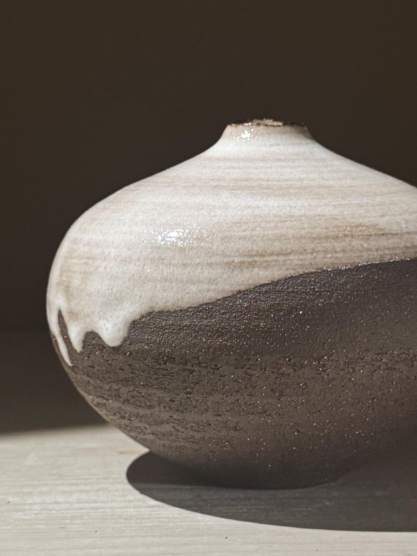 Orb Vase – Yuki Black #03 featuring unique glaze patterns and a soft spherical form, perfect for elegant decor.
