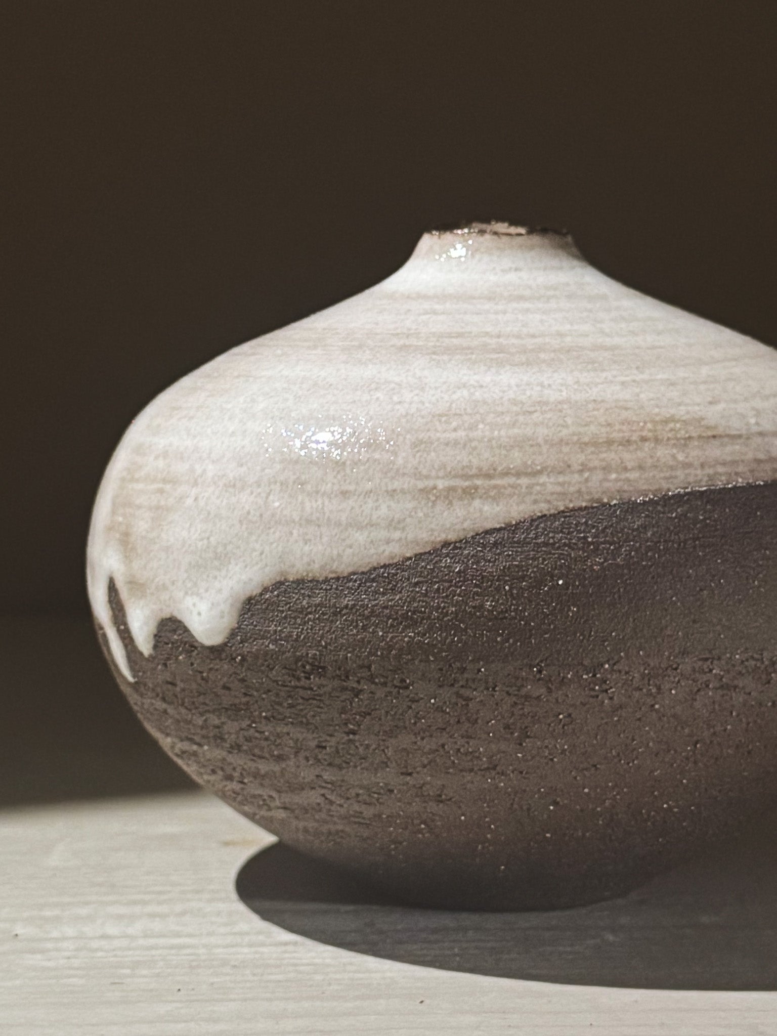 Orb Vase – Yuki Black #03 featuring unique glaze patterns and a soft spherical form, perfect for elegant decor.
