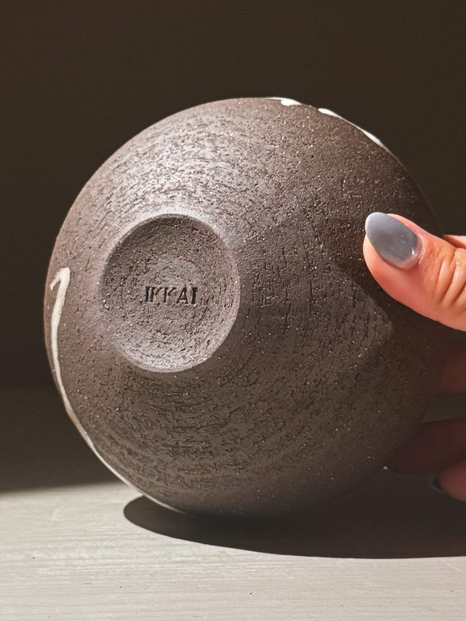 Orb Vase – Yuki Black #03, showing the unique texture and design of the base, emphasizing its sculptural form.