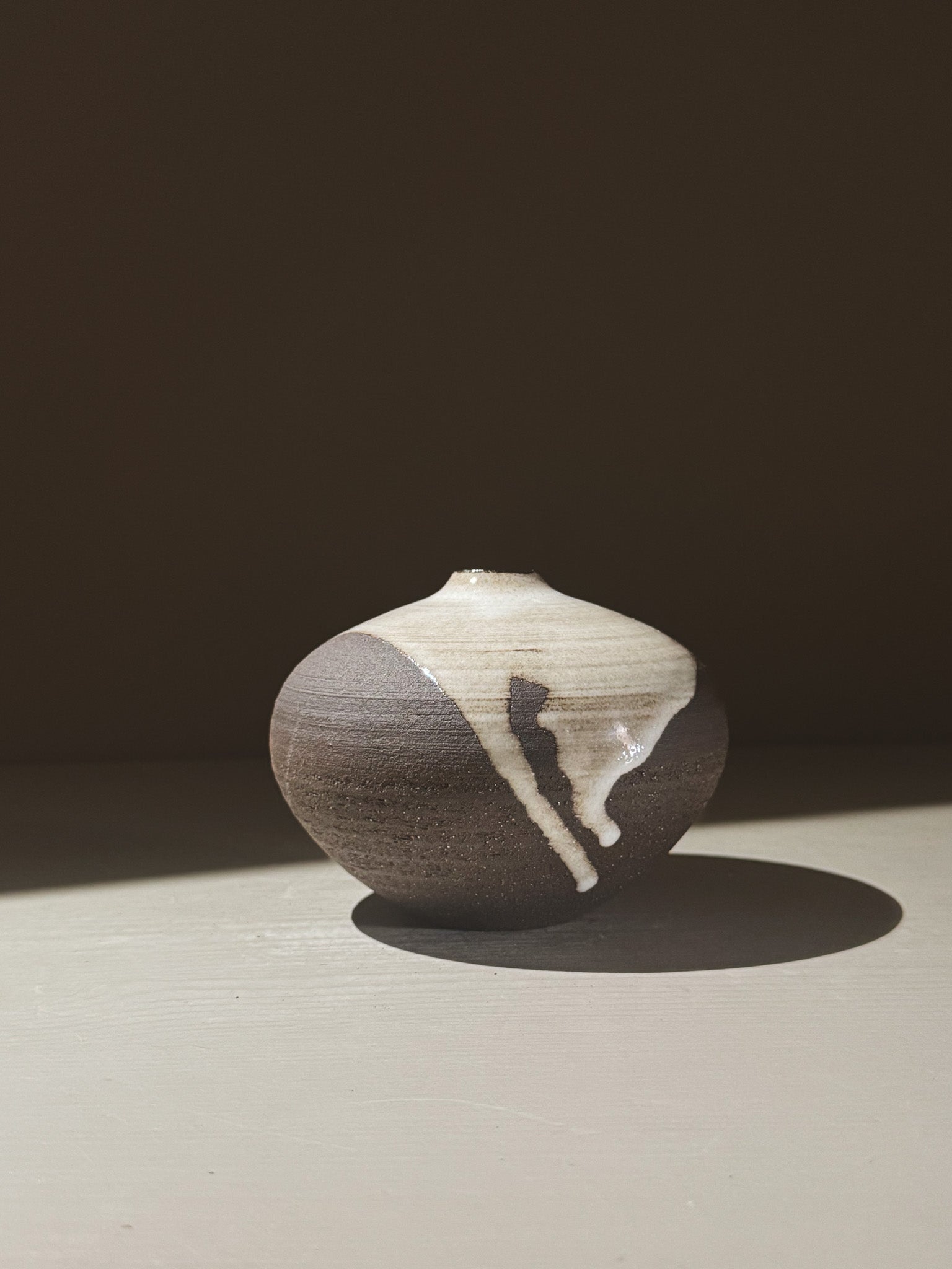 Orb Vase – Yuki Black #05 showcasing organic glaze patterns and rounded design, perfect for unique decor.