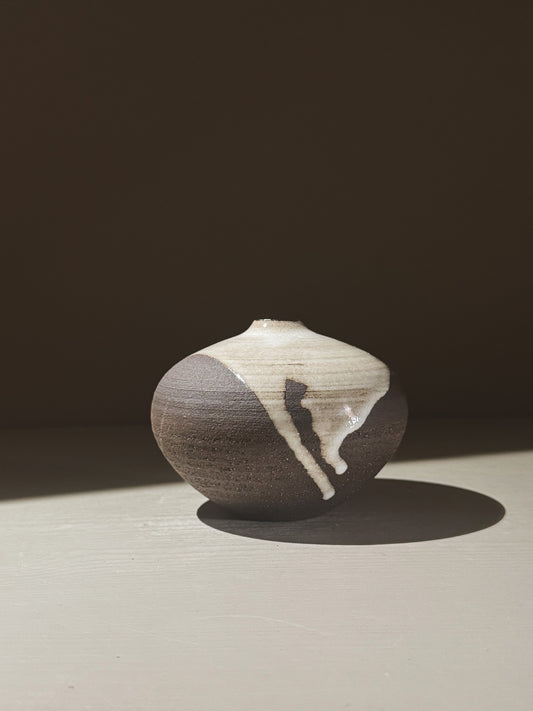 Orb Vase – Yuki Black #05 showcasing organic glaze patterns and rounded design, perfect for unique decor.