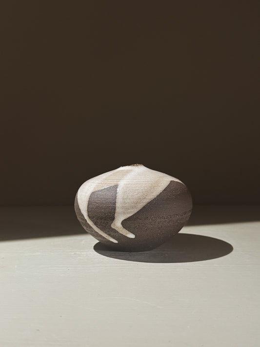 Orb Vase – Yuki Black #06 showcasing unique glaze patterns and soft spherical design.