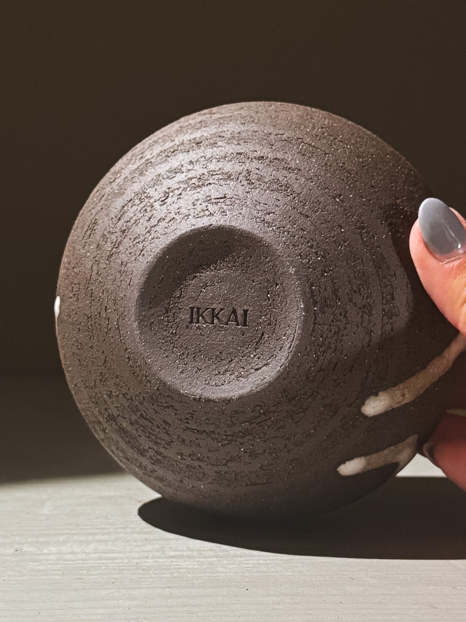 Orb Vase – Yuki Black #06 with a textured surface and unique glaze patterns, showcasing its sculptural presence.