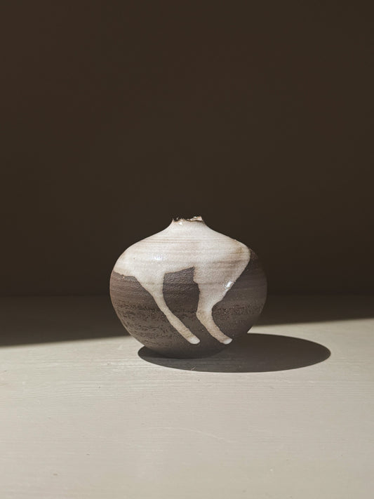Orb Vase – Yuki Black #08 showcasing unique glaze patterns and soft spherical form.